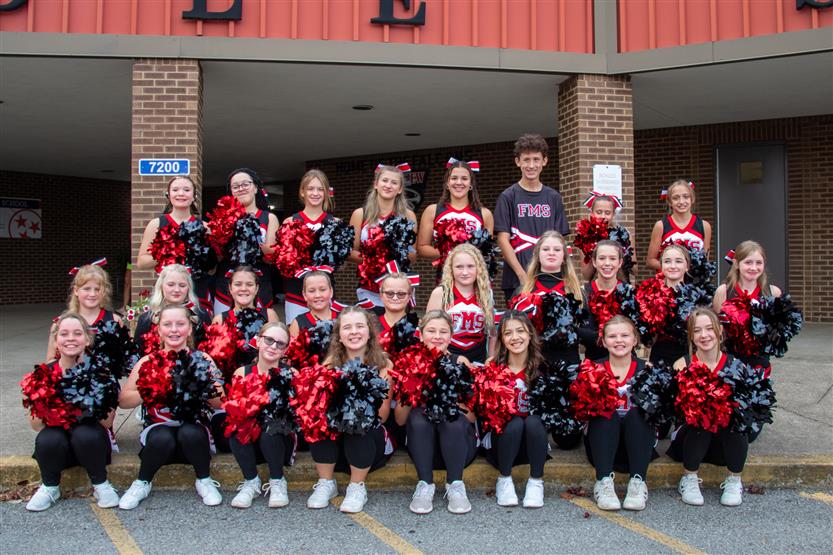 Cheerleaders pose on the first day of school